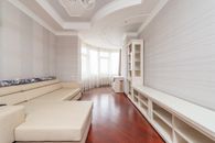 White Couch on Brown Wooden Parquet Flooring
