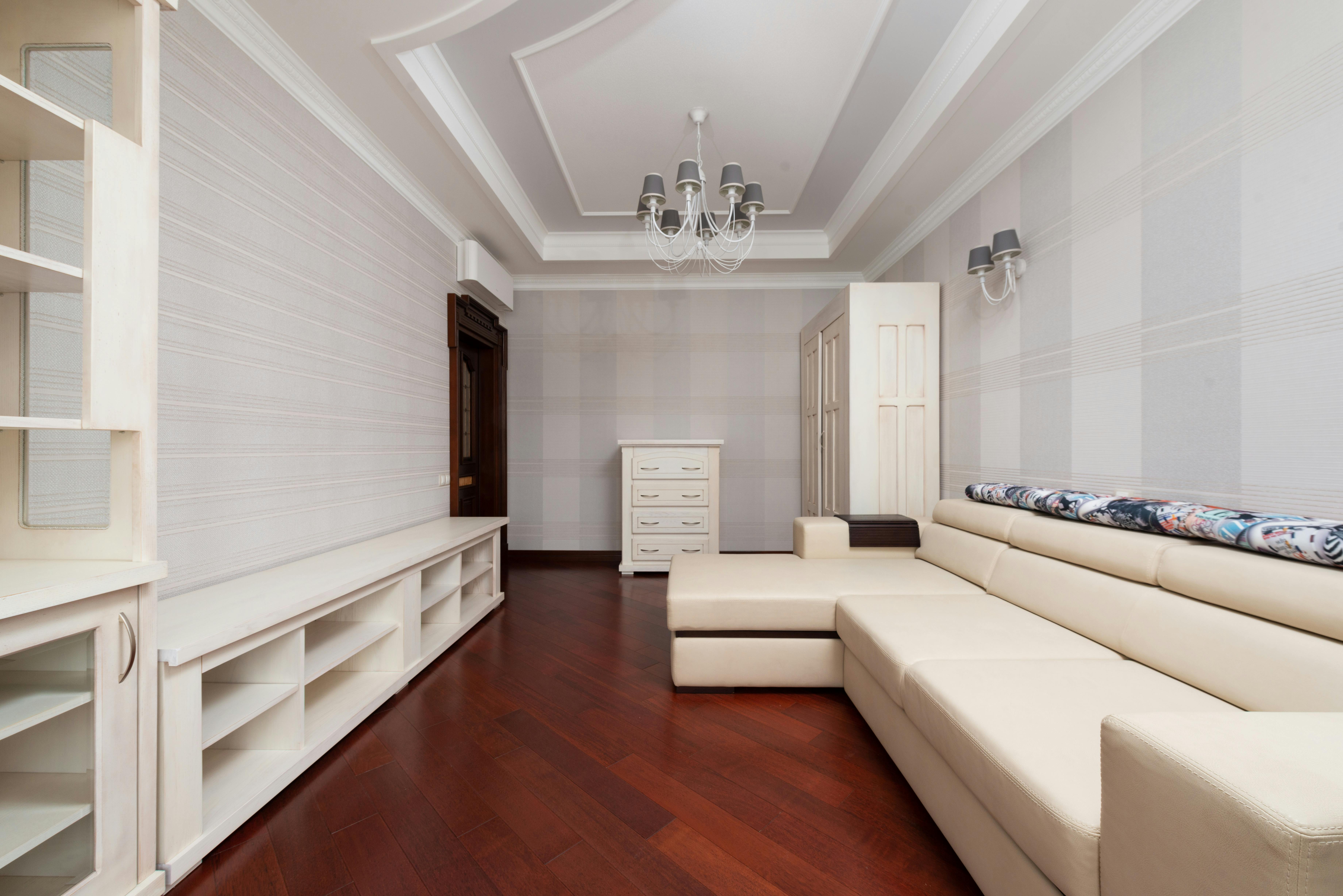 Disorganized home transformed into a calm space with minimalist storage shelves and compact foldable furniture