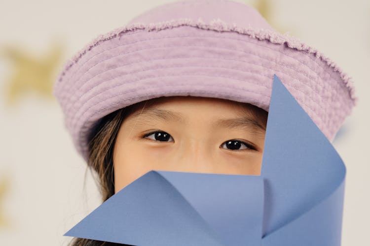 A Girl In Purple Hat