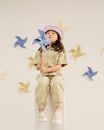 Girl in Blue and White Star Costume Standing and Smiling