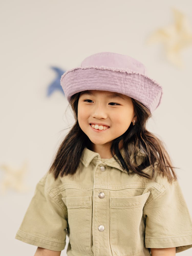 A Girl Wearing Purple Hat