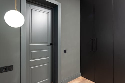 Free Gray Door on Gray Concrete Wall Stock Photo