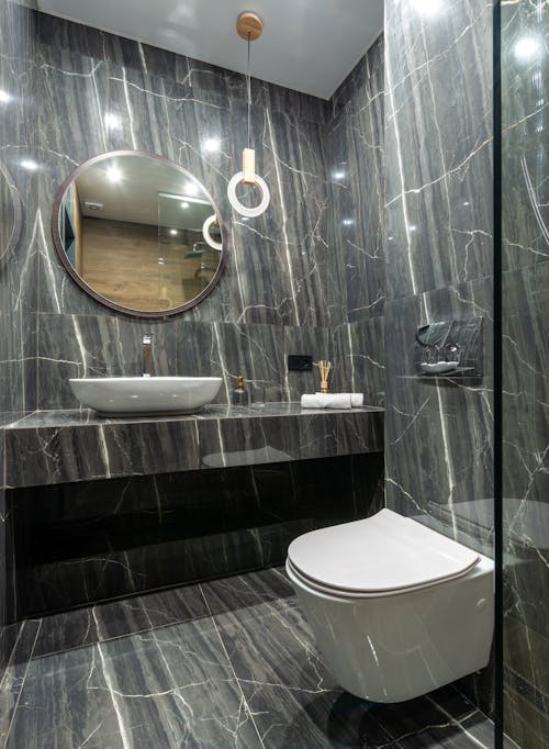 A White Ceramic Sink and Toilet Bowl