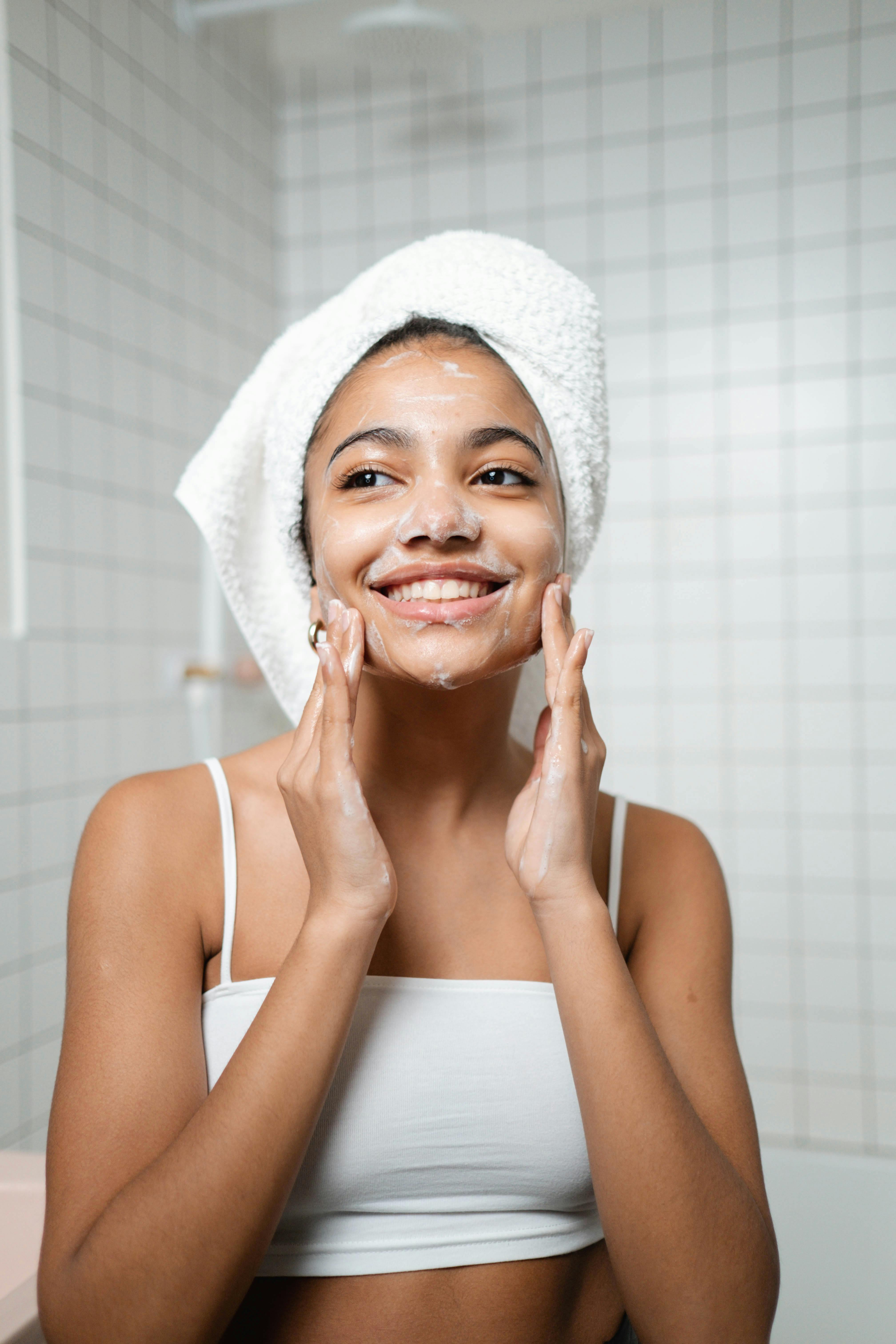 woman washing her face