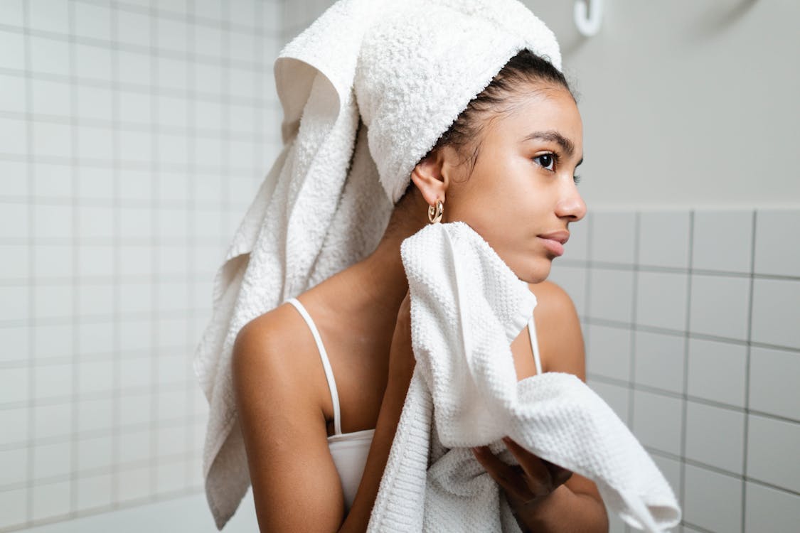 Free Woman in White Tank Top With Fresh Skin Stock Photo