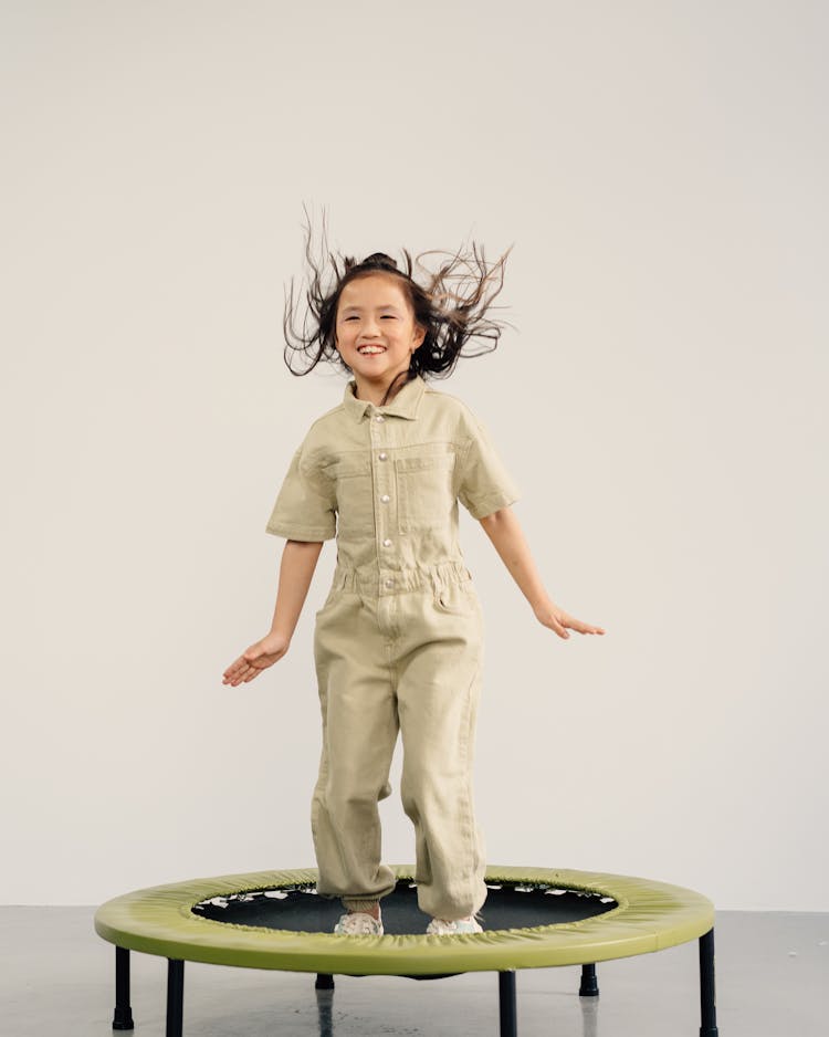 Girl Jumping On The Trampoline