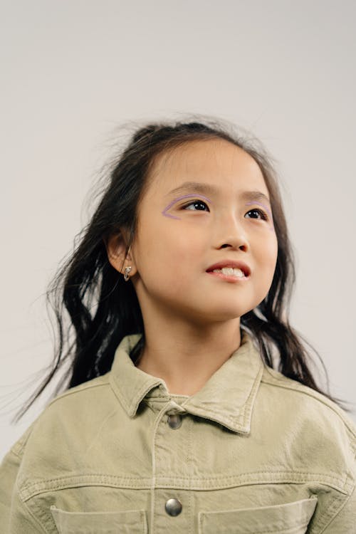 Free Portrait of a Girl Wearing Beige Denim Top Stock Photo