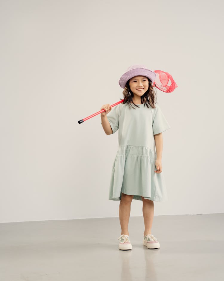 Girl Carrying Butterfly Net