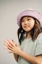 Woman in White Shirt Wearing Pink Knit Cap