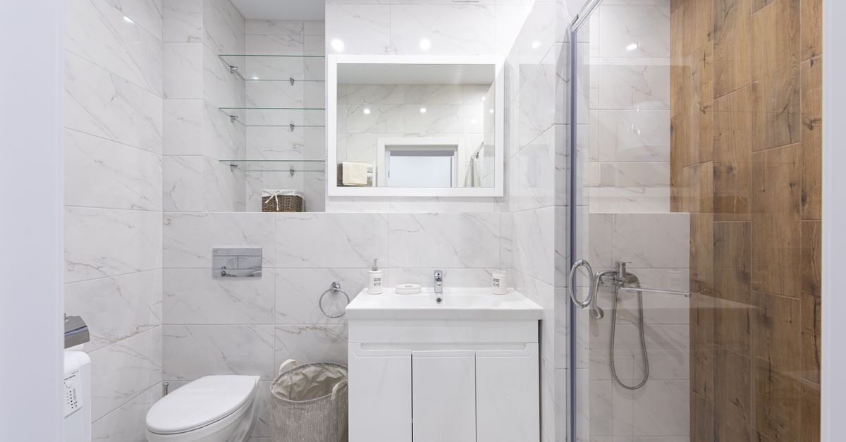 Sparkling clean modern bathroom with polished fixtures and spotless tiles