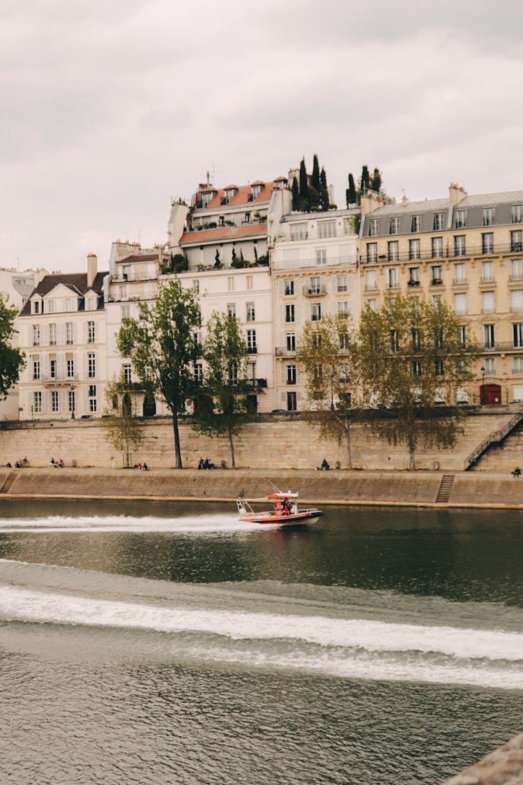 Red Speedboat On River