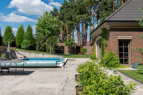 Swimming Pool near House in Summer
