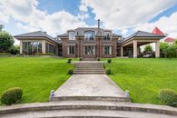 Frontage of an Estate Under a Cloudy Sky