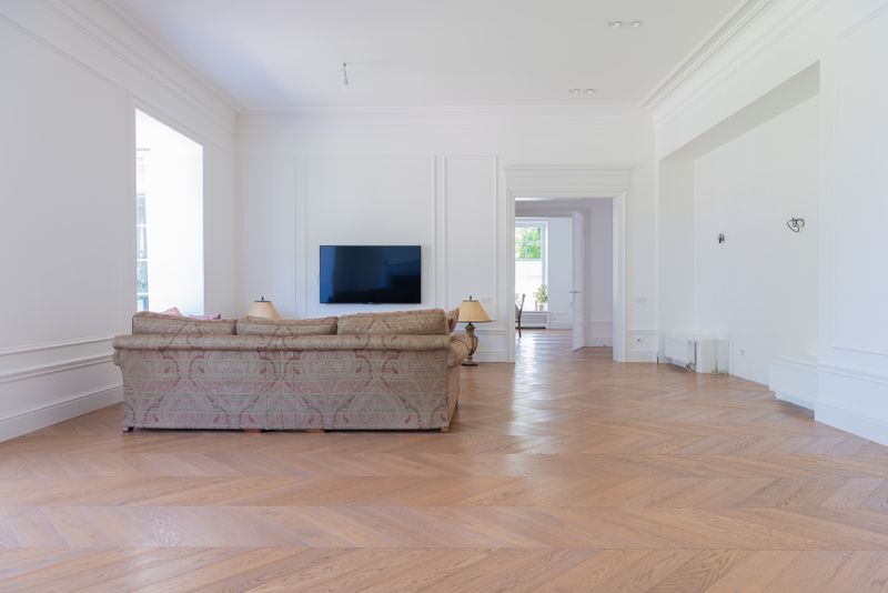 Beige Tile Flooring Transitioning into a Matching Accent Wall