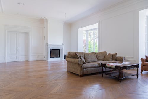 Brown Sofa Near Fireplace