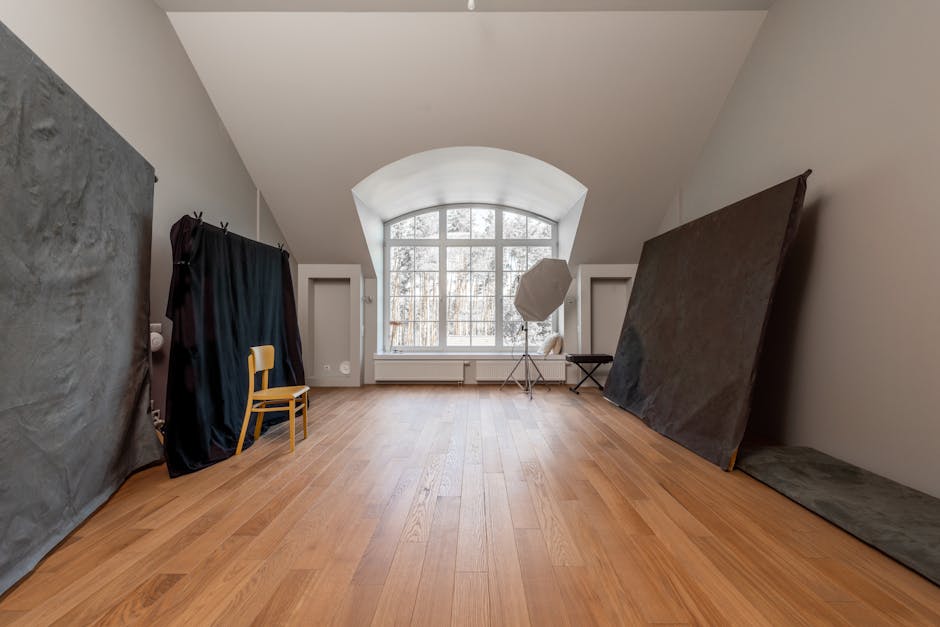 How Blackout Curtains Boost Melatonin and Deep Sleep Duration Spacious photography studio with angled ceilings and wooden floors, ideal for creative shoots.