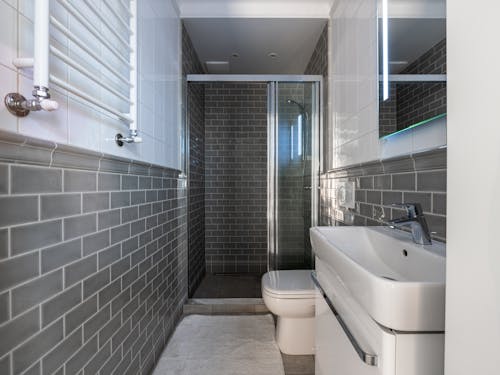 Spacious Bathroom with Tiled Walls
