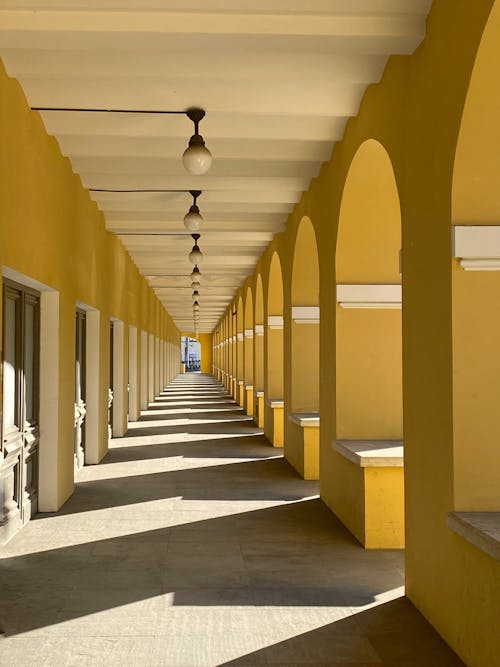 Free White and Yellow Concrete Hallway Stock Photo