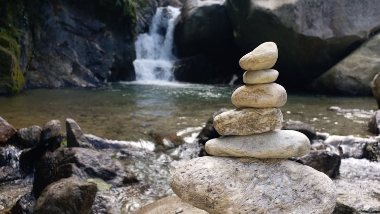 Stacked Of Pebbles On A River