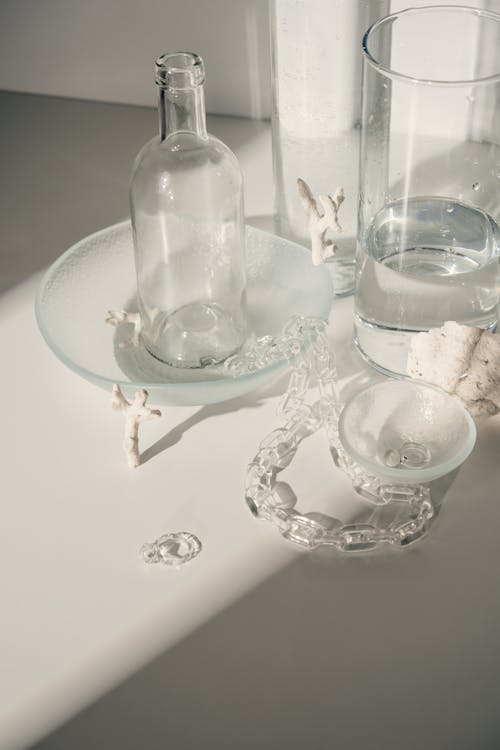 Clear Glass Bottle on the Table