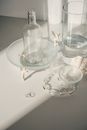 Clear Glass Pitcher on White Table