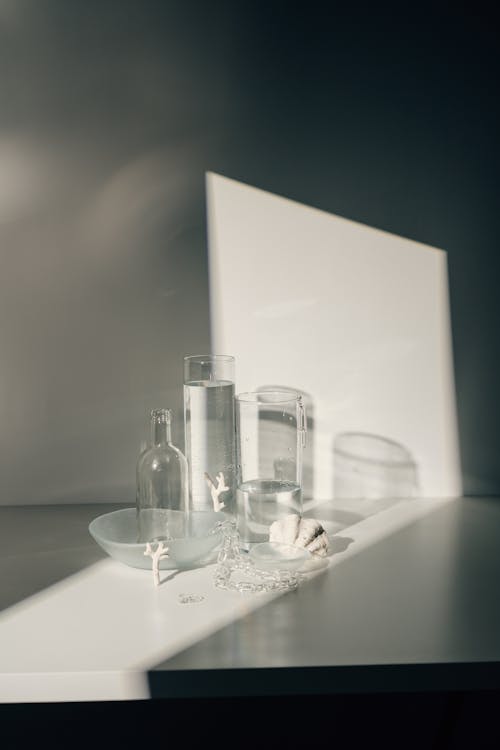 Free Clear Drinking Glasses on White Table Stock Photo