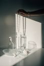 Clear Glass Bottle on White Table