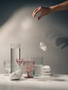 A Hand Dropping a Feather