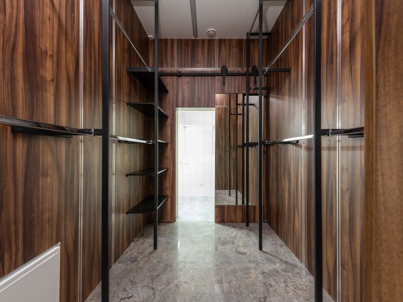 Walk-in wardrobe with timber panelling