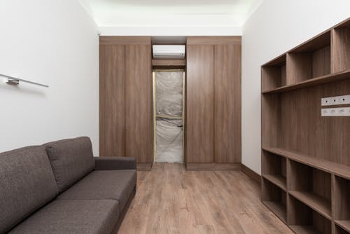 White Room with Wooden Cabinets and Wooden Flooring