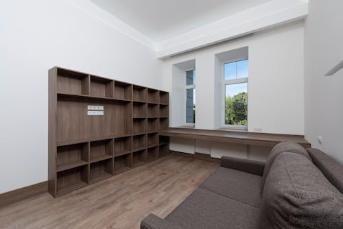 Brown Wooden Shelf in a White Room