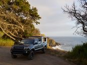 Black Suv on Beach Shore