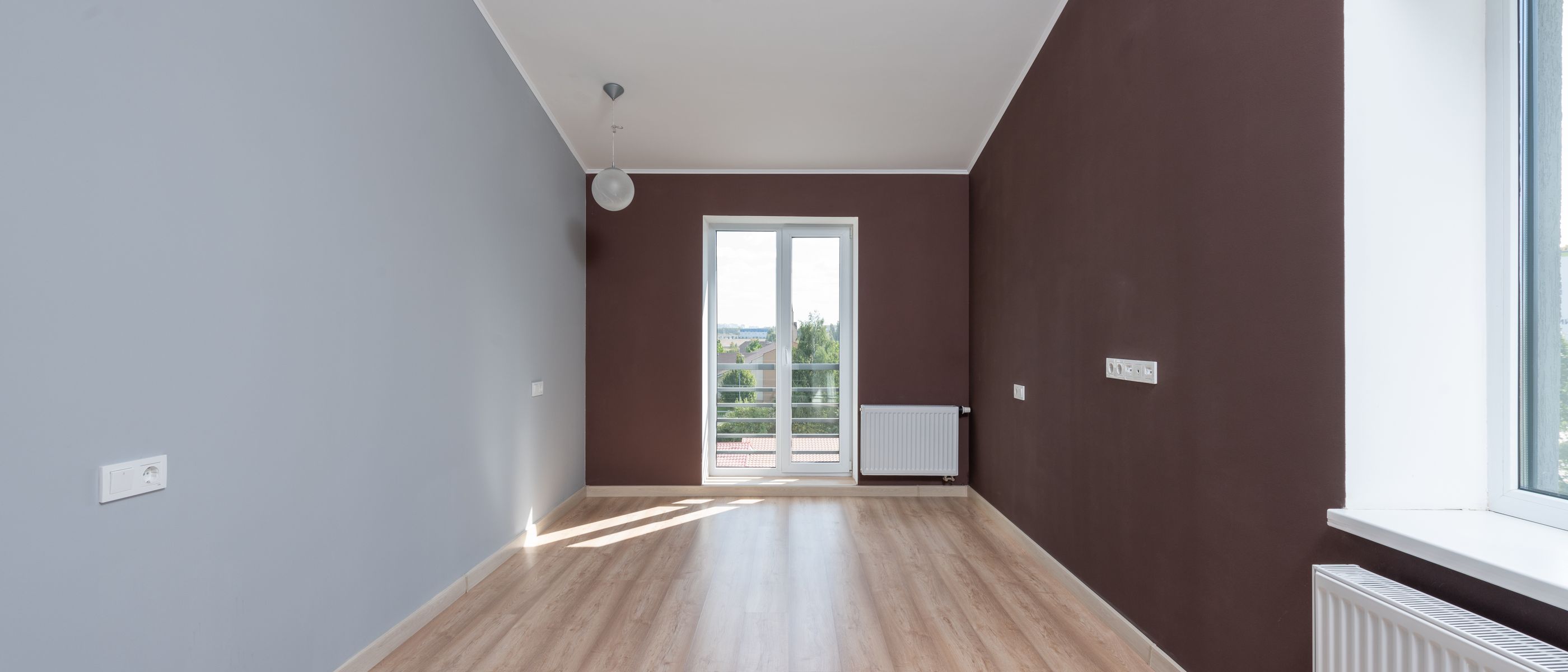 Plastering and Skimming in Wimbledon — quality trade paint going on in two coats