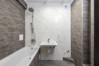 White Ceramic Bathtub With Stainless Steel Shower Head