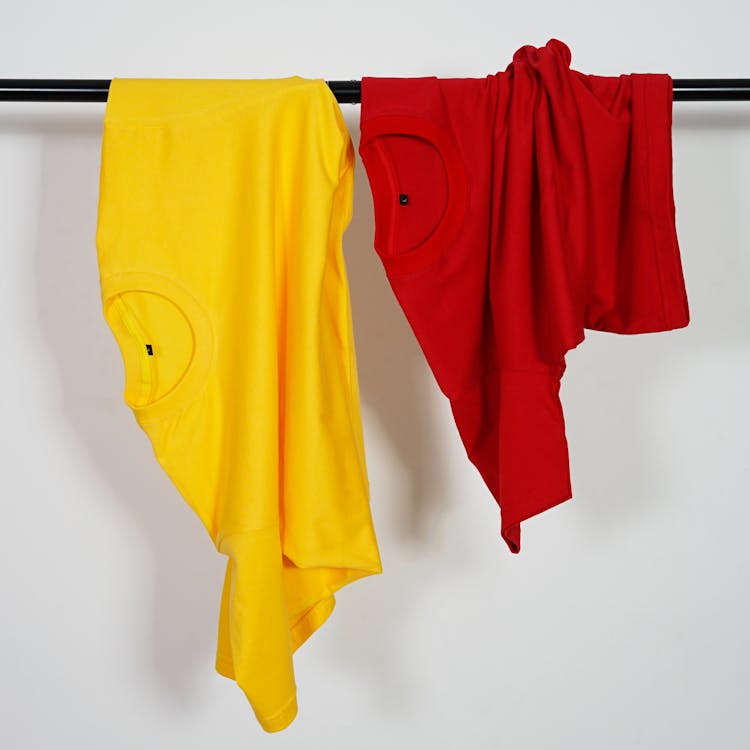 Yellow And Red T-shirt Thrown Over A Rack 