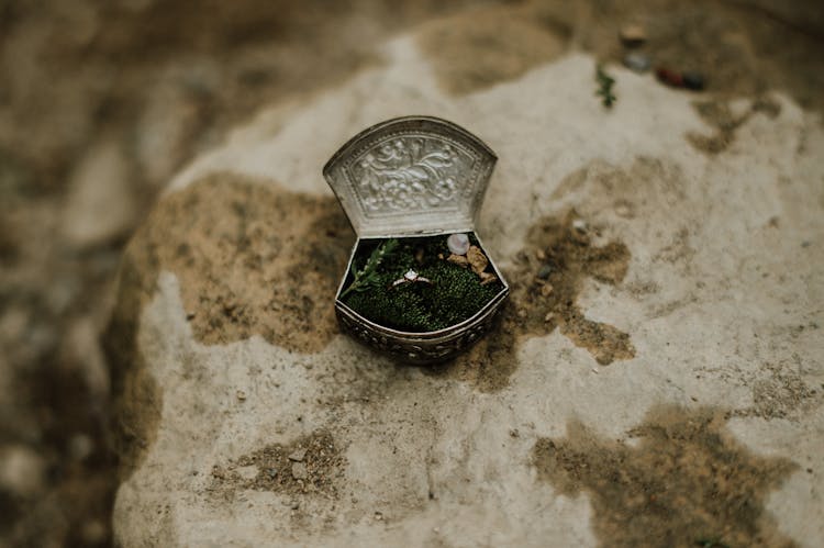 Ring In Ancient Jewelry Box On Stone