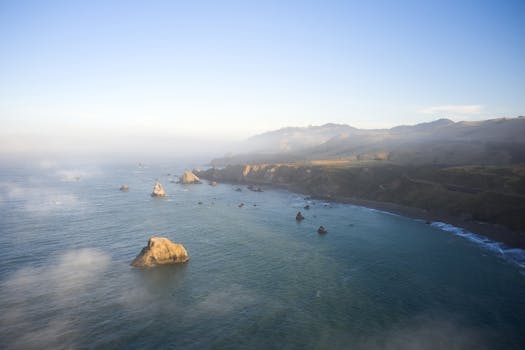 A stunning coastal landscape image showcasing the rugged beauty of Jenner, California during daytime.