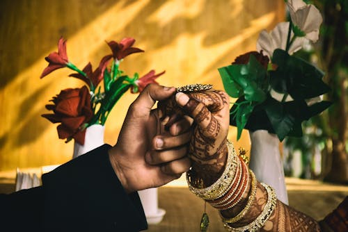 Couple's Hands Together During Wedding