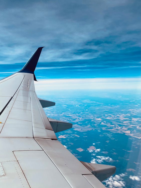 An Aircraft Wing Under the Blue Sky · Free Stock Photo