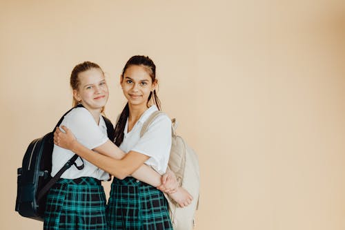 Girls in School Uniform Smiling
