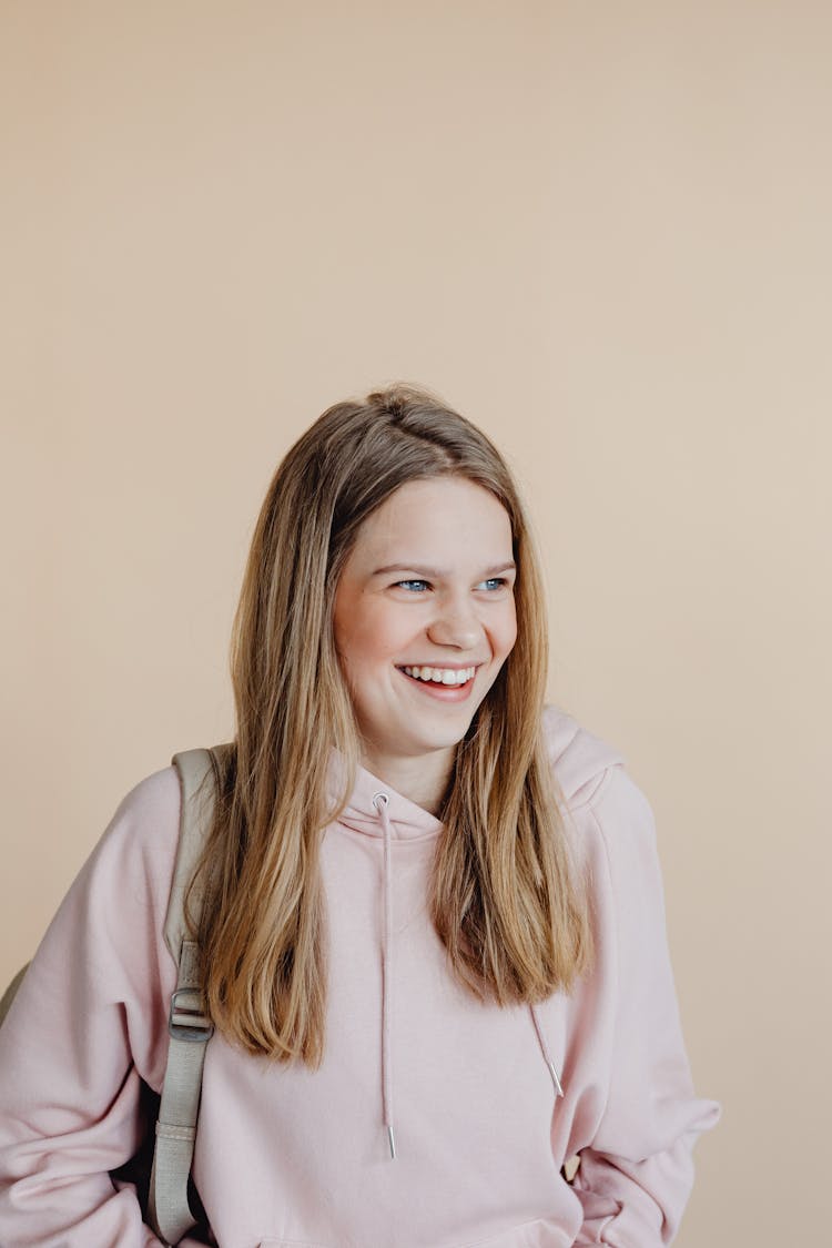 A Woman In Beige Hoodie 