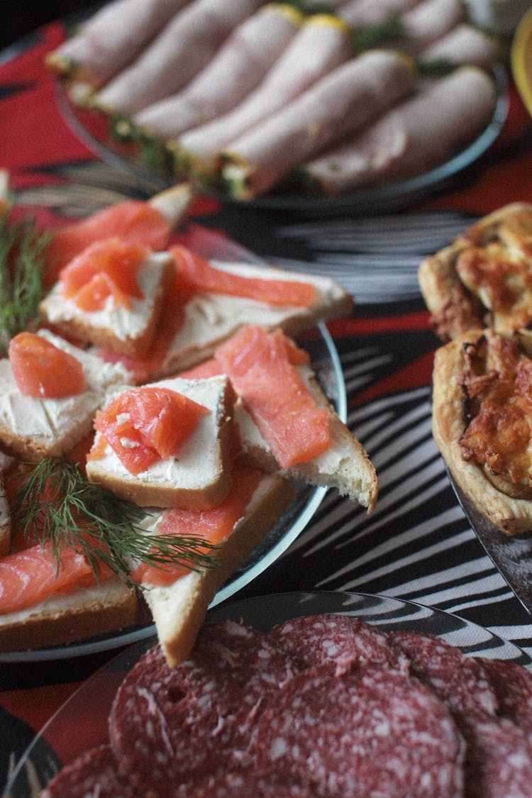 Bite Sized Toasts With Salmon On Plate