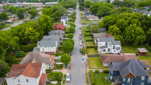 Asphalt Road in Between Houses