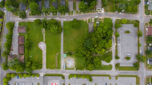 Free Aerial Photography of Parking Near Grass and Trees Stock Photo