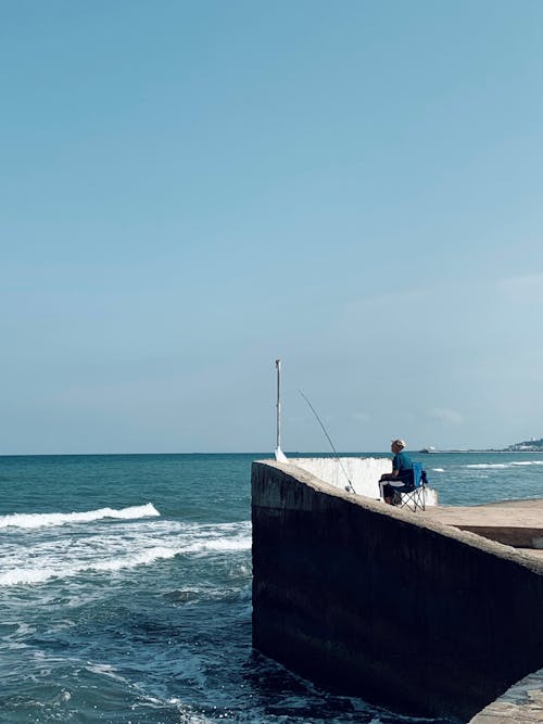 Balık tutmak, balıkçı, deniz içeren Ücretsiz stok fotoğraf