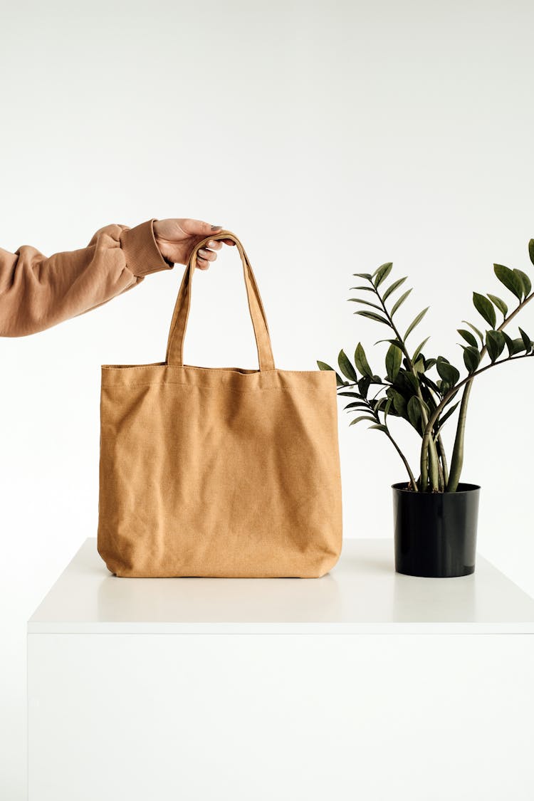 Brown Tote Bag On White Table