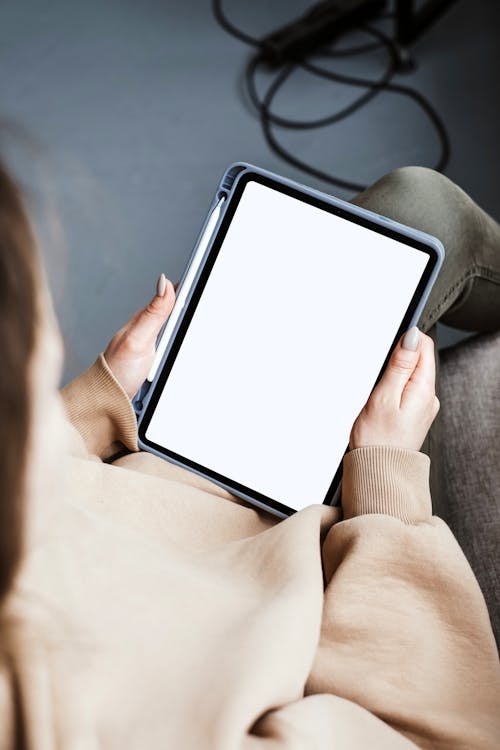 Free Person Holding a Tablet Stock Photo