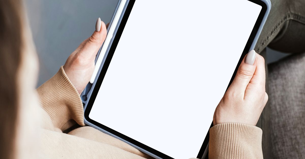 Person Holding a Tablet · Free Stock Photo