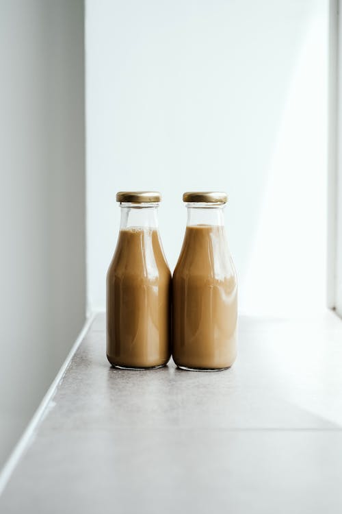 Free Two Chocolate Drinks In Glass Bottles Stock Photo