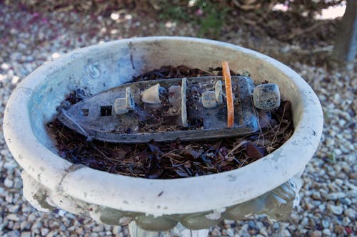 Free stock photo of birdbath, toy boat, wallpaper